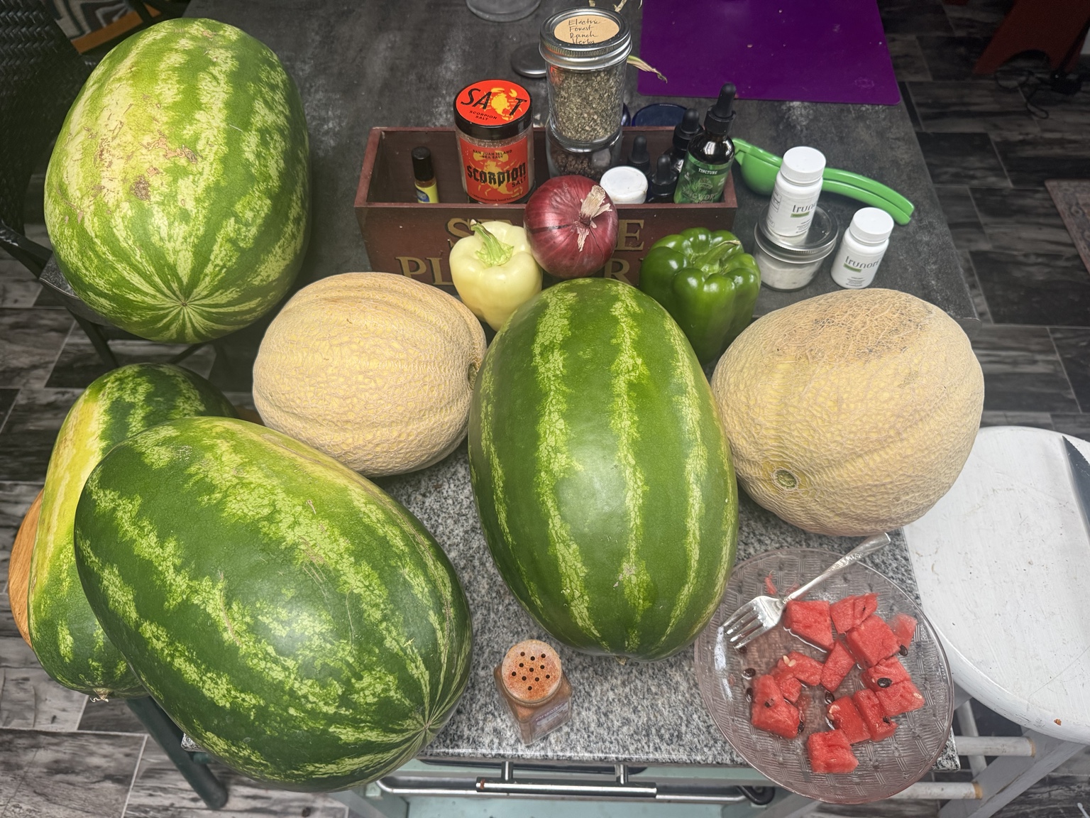 Fresh watermelons, cantaloupes and peppers